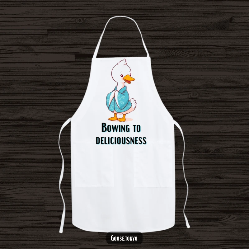 Funny goose apron, a cute goose in a vibrant blue kimono bowing gracefully with a smile, perfect for cooking or baking.