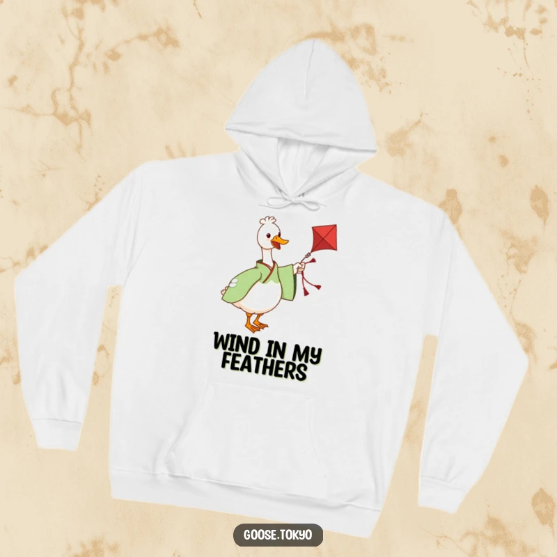 Funny hoodie featuring a charming goose in a green patterned kimono twirling a decorative kite, perfect for staying warm and amused.