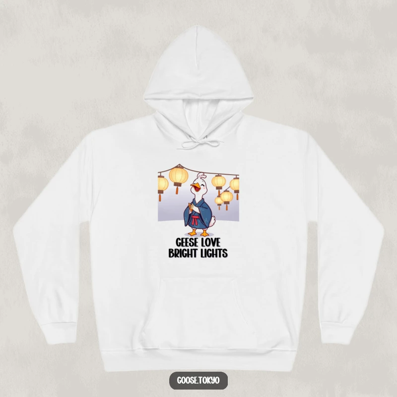 Funny goose hoodie featuring a joyful goose in a blue kimono clapping near illuminated paper lanterns, perfect for cozy and funny festive vibes.