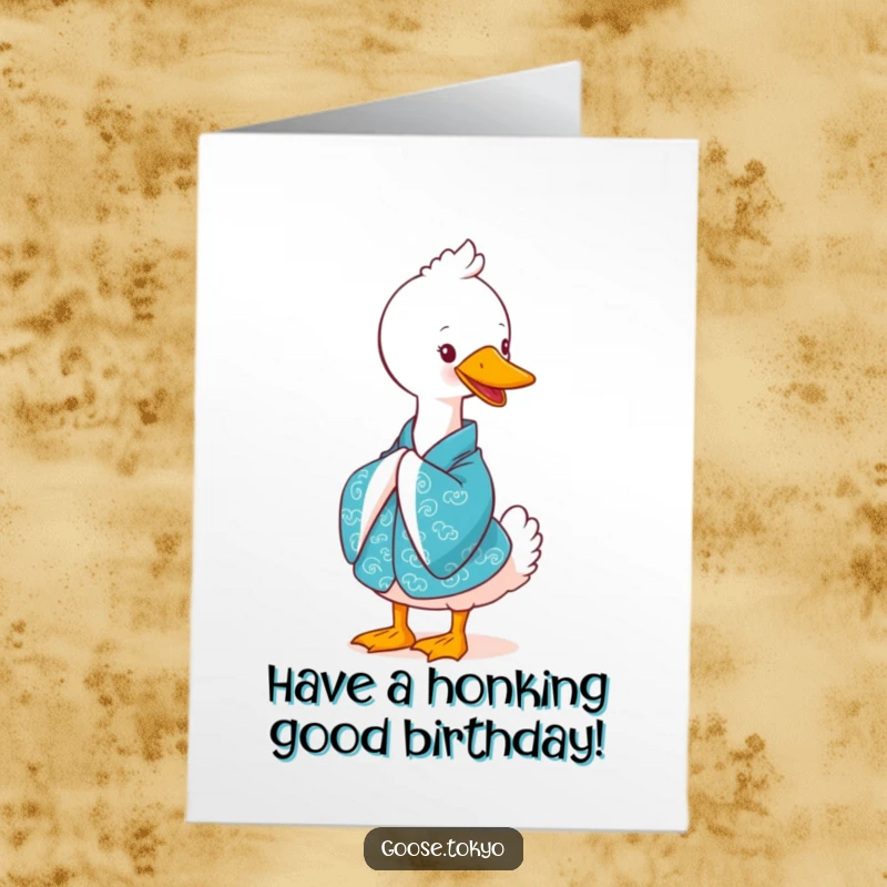 Funny Free Printable Birthday Card: A cute goose in a vibrant blue kimono bowing elegantly with a heartwarming smile, spreading joy.