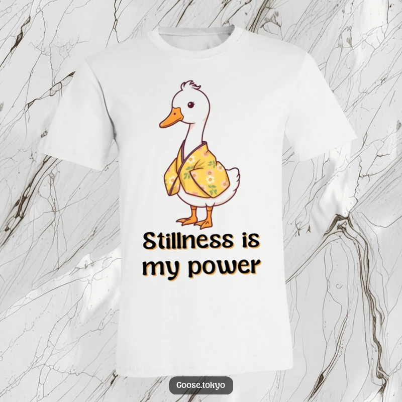 Funny goose t-shirt featuring a serene goose standing still in a yellow floral kimono, ideal for a peaceful laugh.